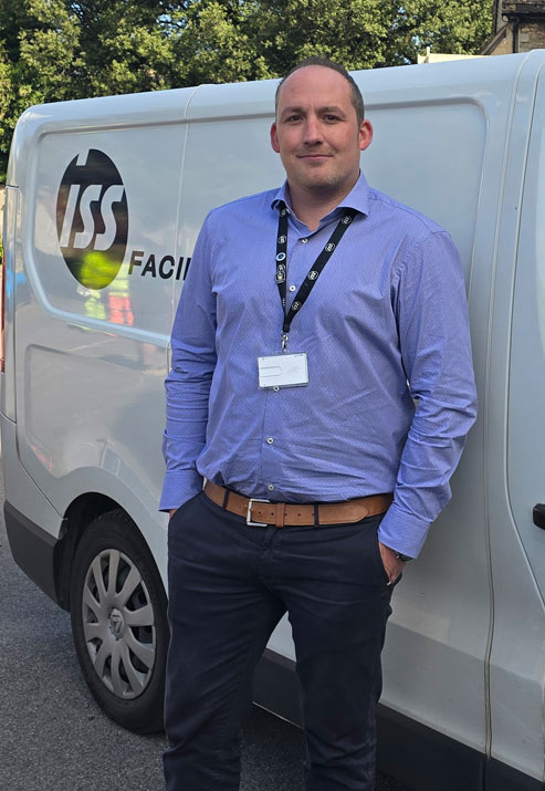 Daniel stood next to a van