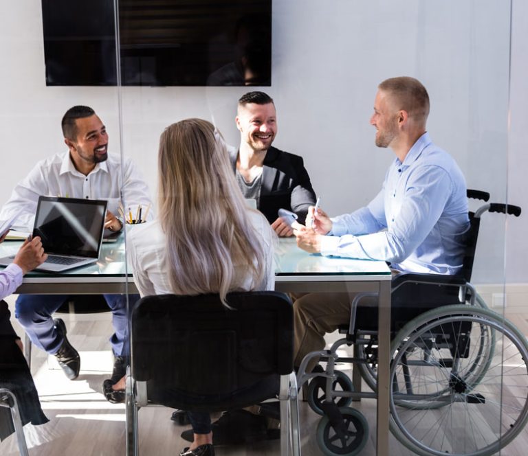 Business meeting with man in wheelchair
